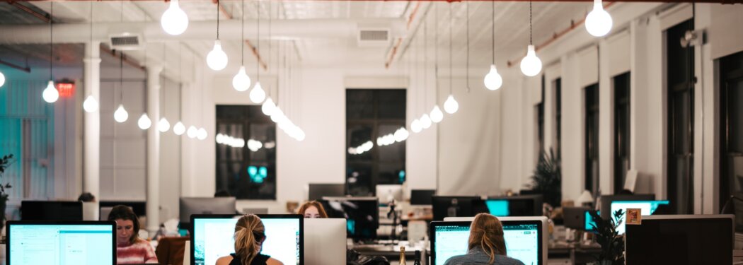 people sitting on chair in front of computer